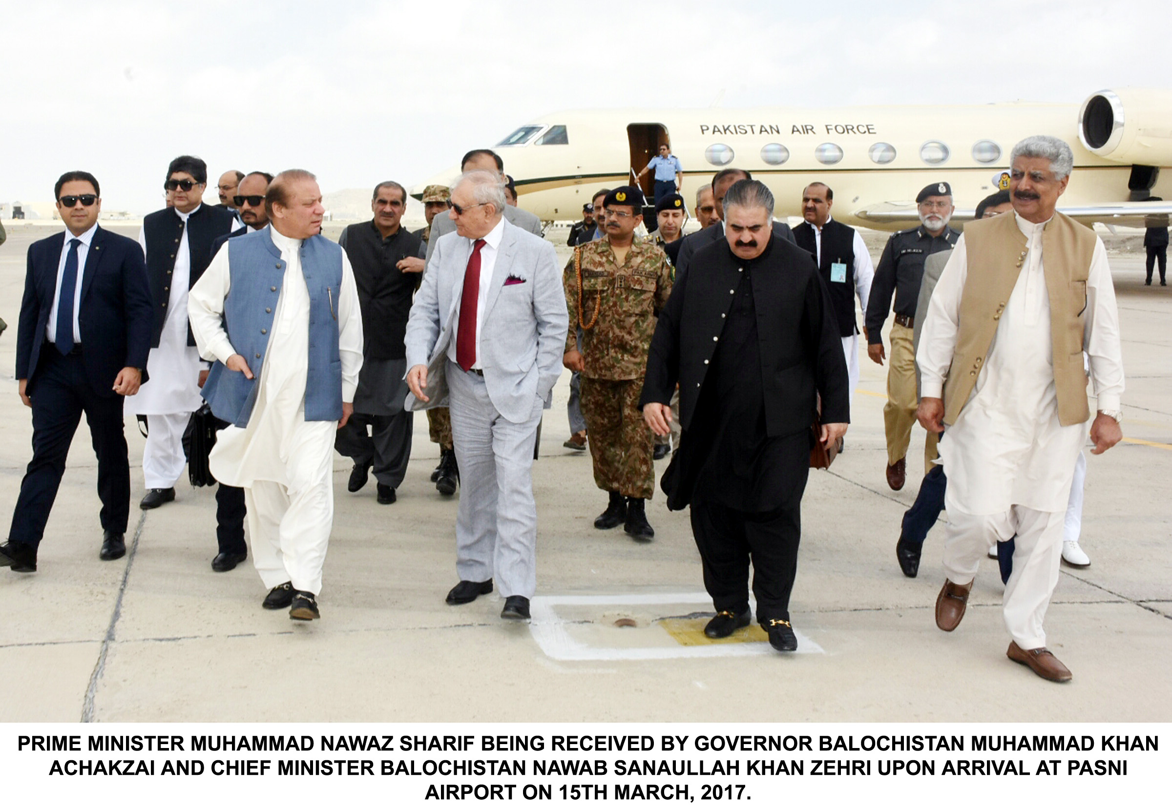 PRIME MINISTER MUHAMMAD NAWAZ SHARIF BEING RECEIVED BY GOVERNOR BALOCHISTAN MUHAMMAD KHAN ACHAKZAI AND CHIEF MINISTER BALOCHISTAN NAWAB SANAULLAH KHAN ZEHRI UPON ARRIVAL AT PASNI AIRPORT ON 15TH MARCH, 2017.