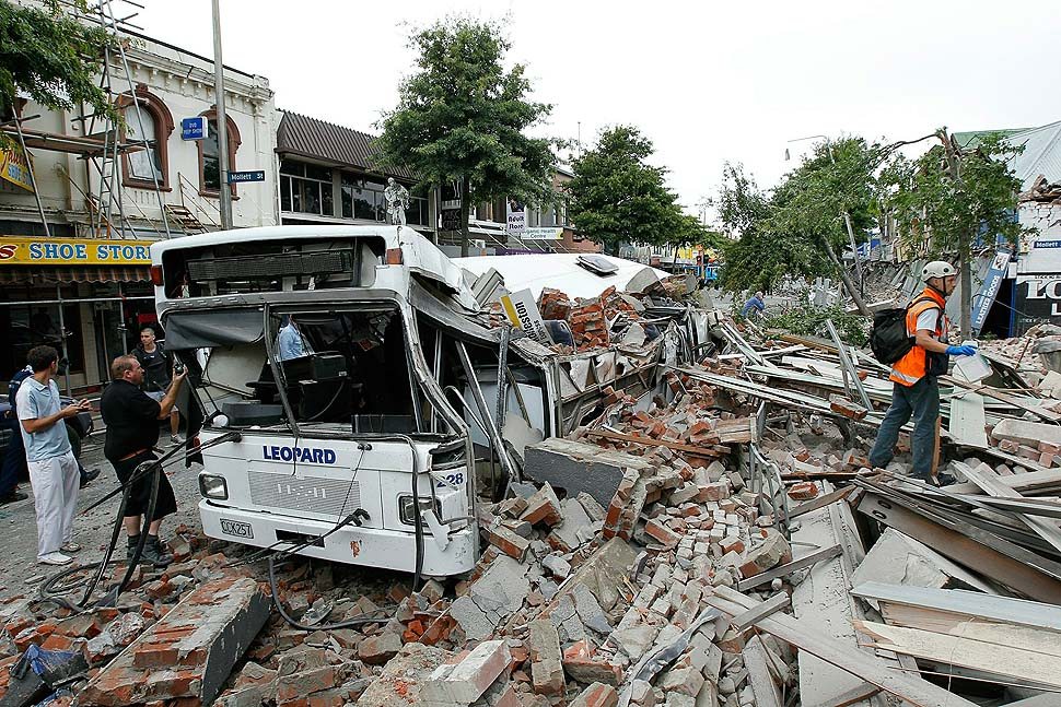 CHRISTCHURCH, NEW ZEALAND - FEBRUARY 23: Bus covered in building debris on February 23, 2011 in Christchurch, New Zealand. The 6.3 magnitude earthquake - an aftershock of the 7.1 magnitude quake on September 4 - struck 20km southeast of Christchurch at around 1pm local time, with initial reports suggesting damage and fatalities far exceeding the initial quake. (Photo by Martin Hunter/Getty Images)