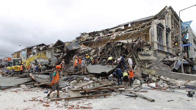 CHRISTCHURCH, NEW ZEALAND - FEBRUARY 23: Rescue workers search for survivors on February 23, 2011 in Christchurch, New Zealand. The 6.3 magnitude earthquake - an aftershock of the 7.1 magnitude quake on September 4 - struck 20km southeast of Christchurch at around 1pm local time, with initial reports suggesting damage and fatalities far exceeding the initial quake. (Photo by Martin Hunter/Getty Images)